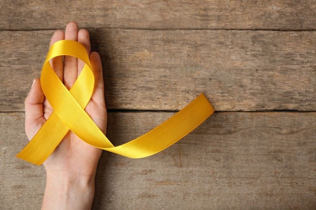 yellow ribbon on wooden table